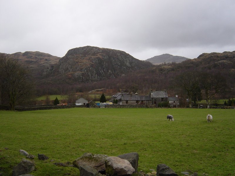 Seathwaite with Wallowbarrow Crag behind and Harter Fell in the distance, right.