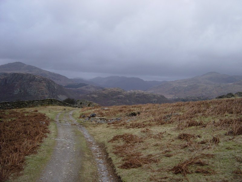 Looking along Park Head Road. Esk Pike is in the distance, directly in line with the road, next right is the pointy Bow Fell, Crinkle Crags and Cold Pike.
