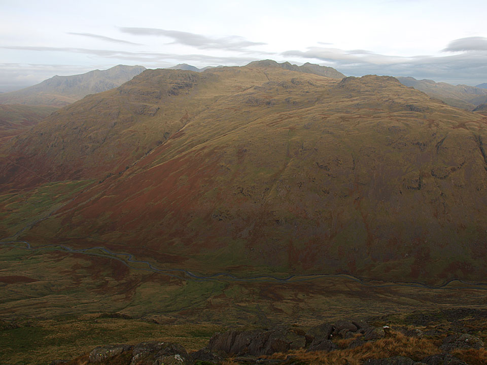 A glimpse of the Scafells beyond Wrynose Fell from Hell Gill Pike.