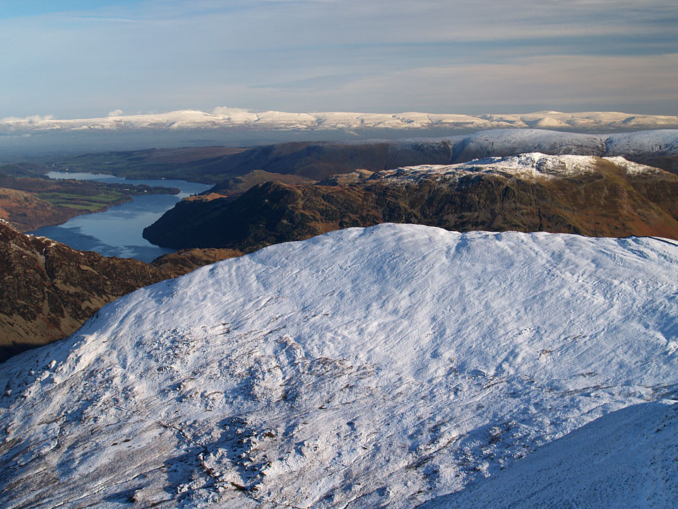 A great view of The Pennines and Ullswater from Catstycam with Place Fell, centre right, over Birkhouse Moor