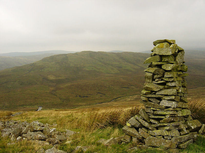 The cairn on Whatshaw Common, with Robin Hood behind